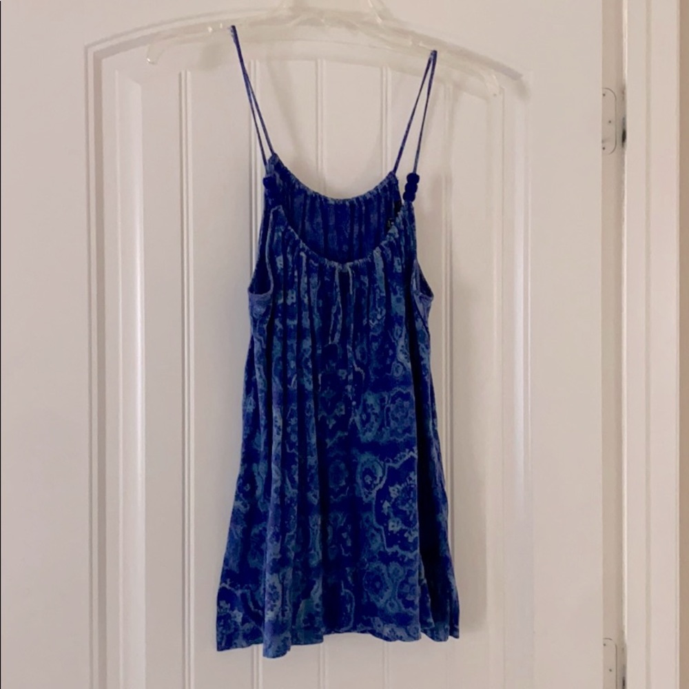 Navy blue with lighter blue paisley like print.